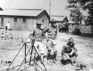 Historical photo of Signal Corpsmen training in a field at Camp Little Silver