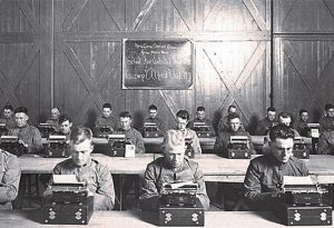 A group of Signal Corpsmen at typewriters